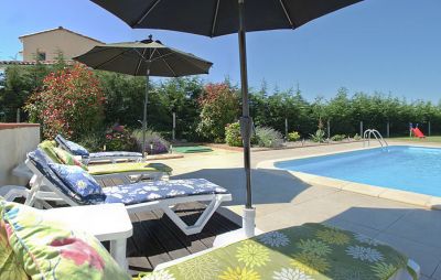 Sun loungers beside pool