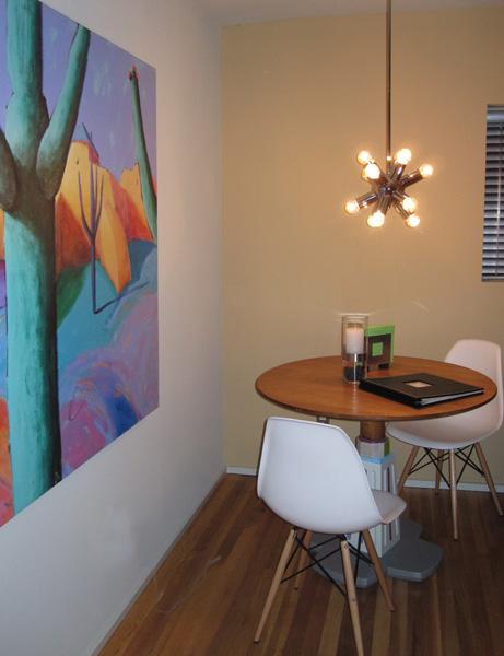 Dining area w/table by local artist