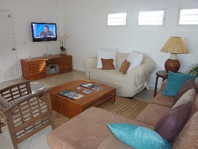 The living room with sofas and satellite TV