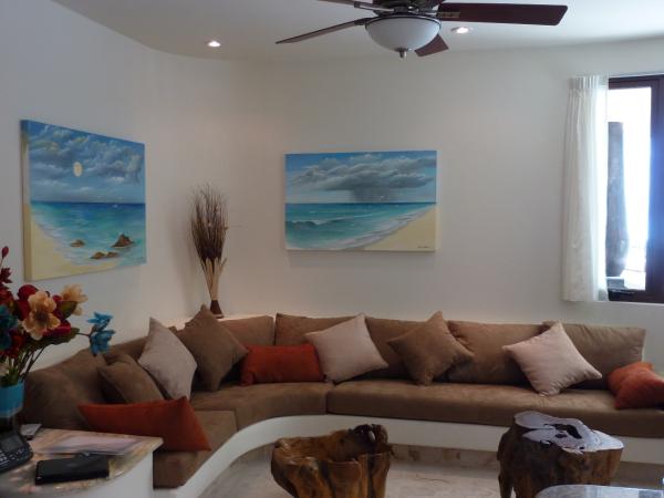Living Room has windows facing beach and water