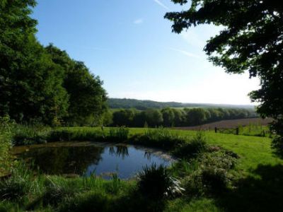 View of countryside from pond