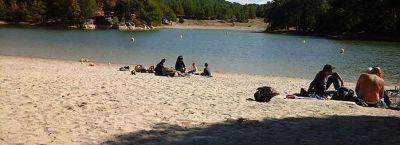 Relaxing on beach beside lake in national park
