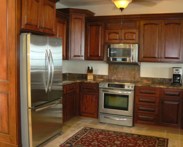 mahogany custom kitchen with granite and stainless