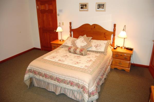 Queen Suite bedroom with Gasfire + Sitting Room.