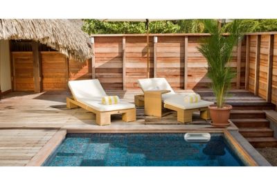 Sun loungers beside private pool