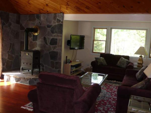 Living room seating for 7 with wood stove and HDTV