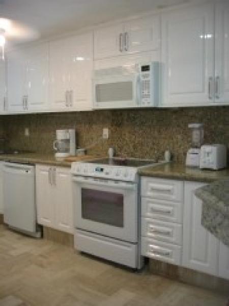 Kitchen WITH GRANITE COUNTERS AND CANADIAN CABINET