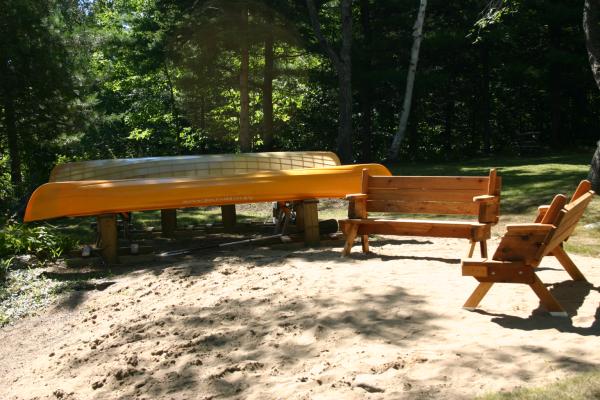 Sandy beachfront area with benches