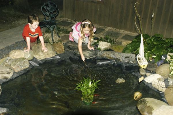 Kids in Goldfish  Pond at Riverstone Lodge