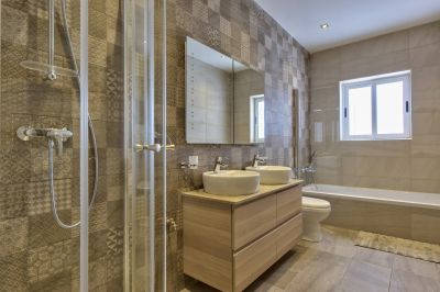 Bathroom with shower and separate bath