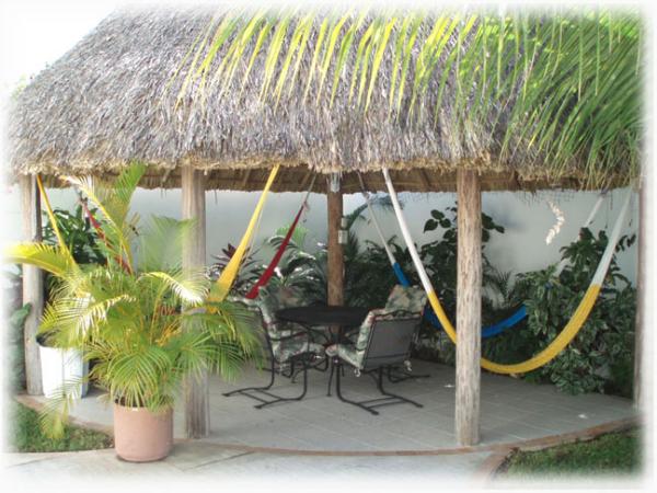 Large palapa with table, chairs and hammocks