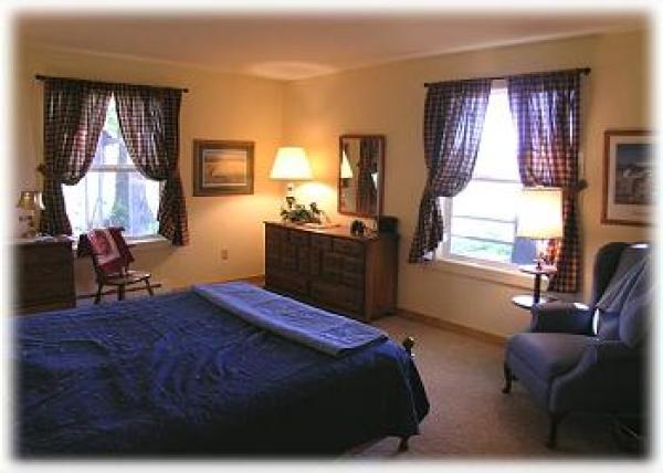 The master bedroom with queen size bed