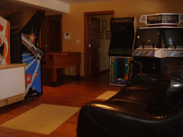 Game Room with Arcade Games & Queen Sofa Sleeper
