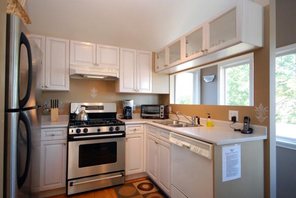 Full kitchen -stainless steel gas stove and fridge