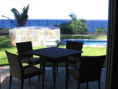 Dine outside beside the pool on covered lanai