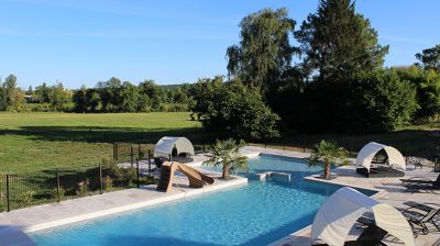 Pool area with covered sun loungers