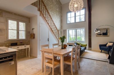 Open plan living space with vaulted ceiling