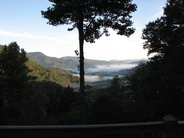 at dawn the fog covers the valley below