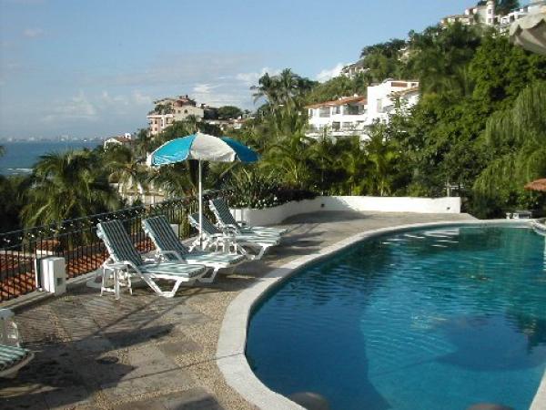 Relax and enjoy the pool and greenery.