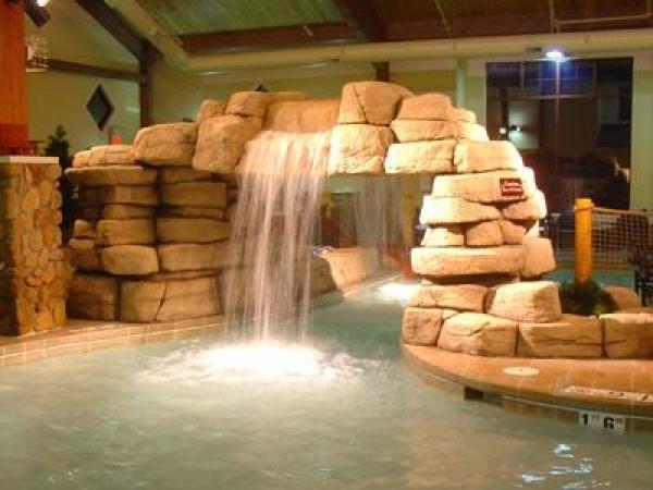 Waterfall separates kiddie and adult pools
