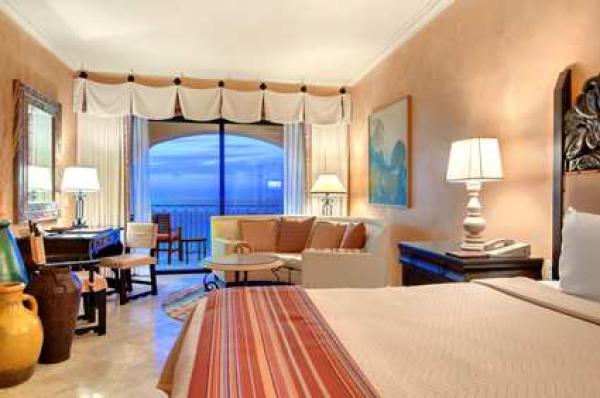 studio with balcony overlooking beach
